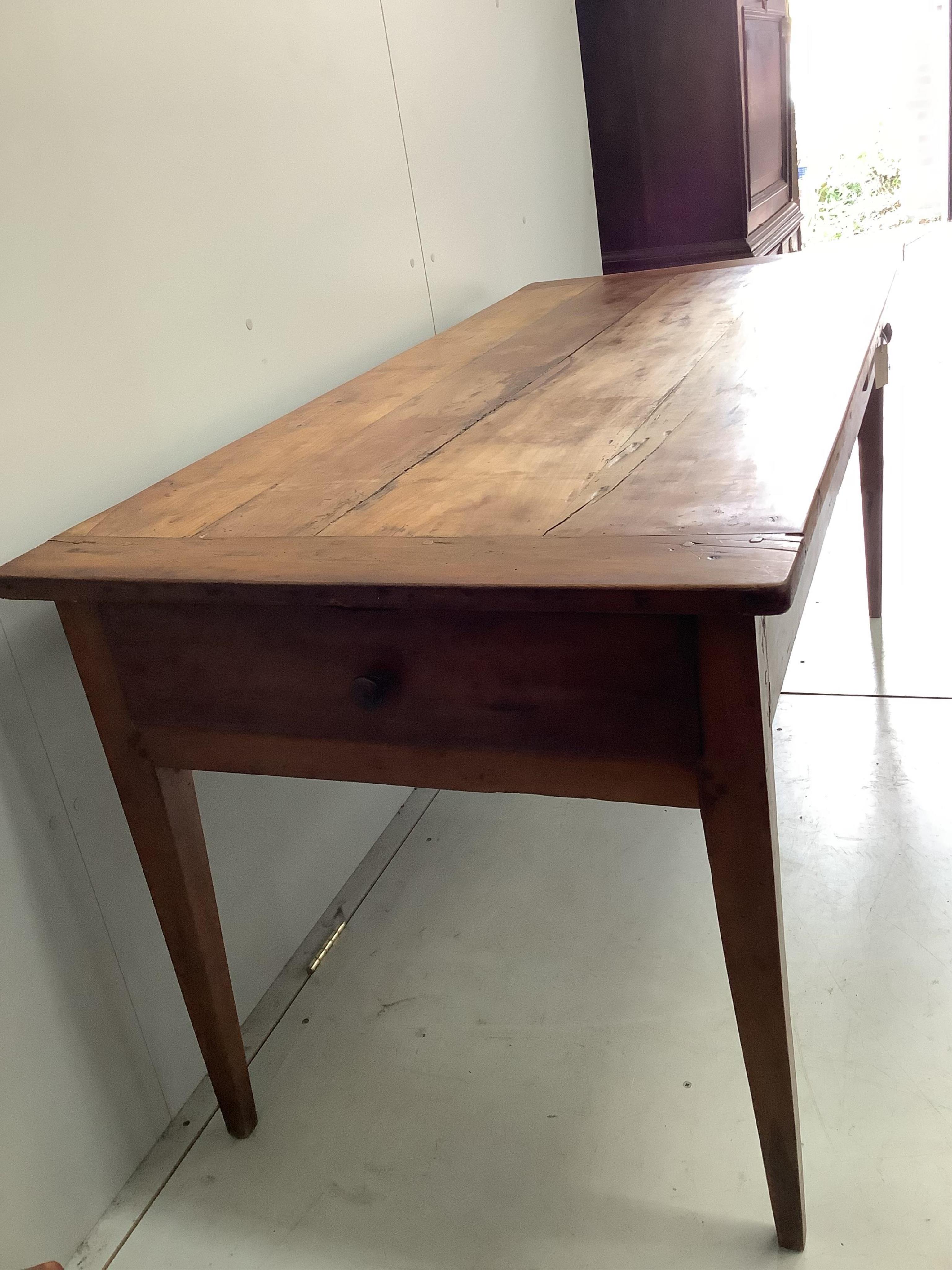 A late 19th century French cherrywood kitchen table with two drawers, width 170cm, depth 78cm, height 78cm. Condition - fair